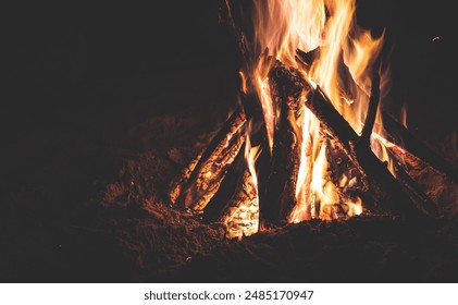 Campfire in the darkness with sparks beautiful flames - Powered by Shutterstock