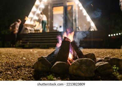 Campfire At Night With House And On Backyard, Close-up Shot Of Bonfire