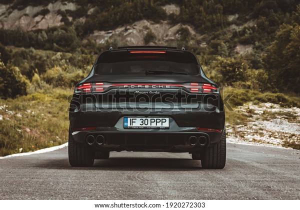 Campina, Romania - June\
5 2020: Porsche Macan Turbo rear end shot, stop lights, wheel and\
exhaust details