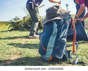 Camping adventure concept from blue hiking backpack and trekking hat. - Powered by Shutterstock