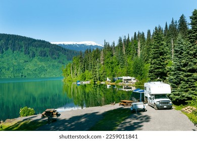 Camping by the beautiful mountain  lake in the summer along Alaska Highway - Powered by Shutterstock