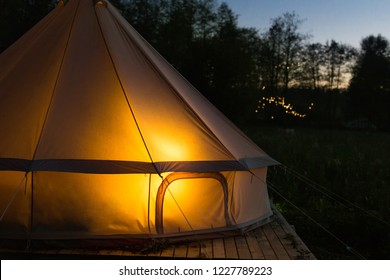 Camping Canvas Bell Tent Glows At Night. Close-up Shot