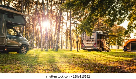 Camping Car In Forest On Sunset.