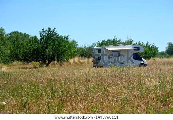 Camping car\
installed in the middle of the\
fields