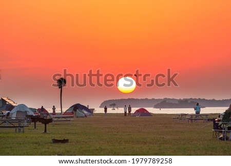 Camping car in recreation site at sunrise