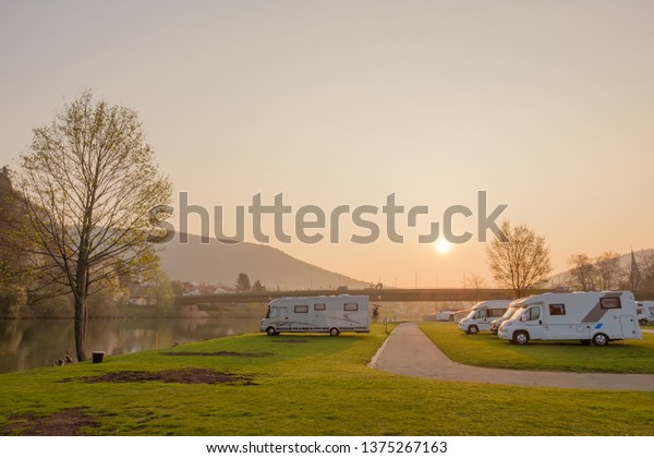 Camping\
caravan parking in camping site on\
sunshine.