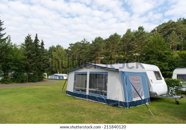 Camping with caravan\
and shelter in nature
