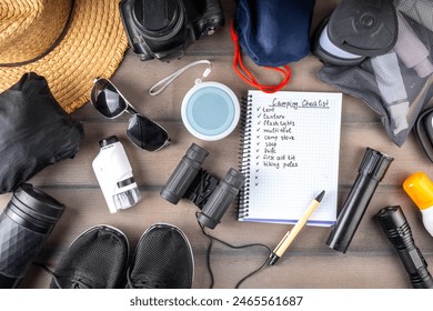 Camping checklist with various camp equipment. List of things for outdoors recreation and travel in nature - tent, first aid kit, cosmetics, accessories, equipment, clothes, trekking shoes - Powered by Shutterstock