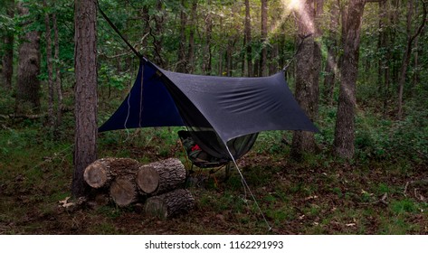 Camping Hammock With Raincover At Sunrise	