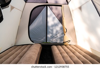 Camping with a large camping tent with inflatable mattresses. - Powered by Shutterstock