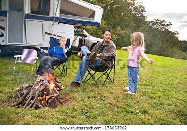 Camping: Little\
Girl Telling Story By\
Campfire