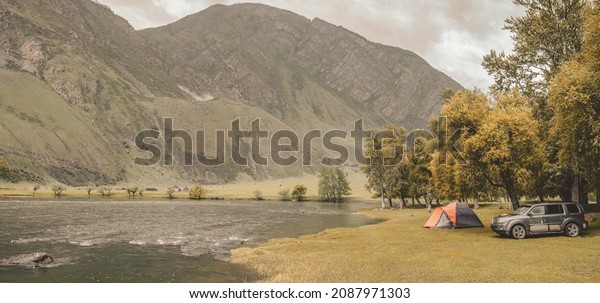 camping on the beach of\
river