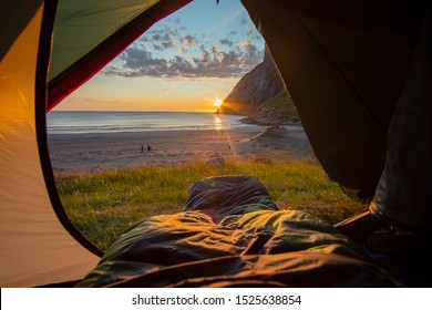 Camping On The Beach At Sunset. Spectacular Sunset View To Rugged Mountain Peaks Above Kvalvika - Famous Surfing Beach At Lofoten Islands, Norway. Lifestyle Summer Journey Vacations