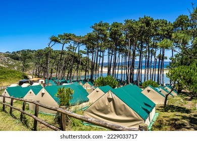 Camping on the Cies Islands Natural Park off the coast of Vigo in Galicia, Spain. The Cies campsite is 150 feet from the beach and has 800 campsite spots. - Shutterstock ID 2229033717