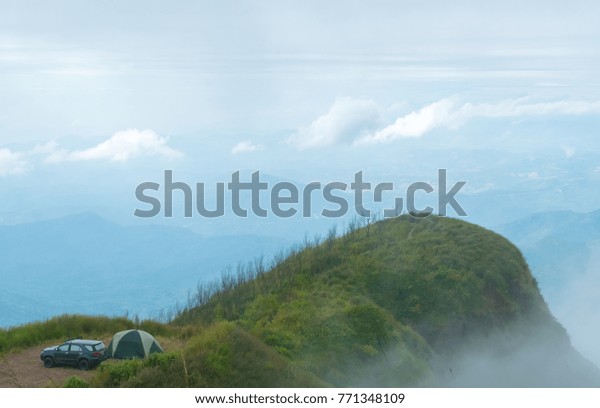 camping\
on green mountain landscape have clouds and\
fog