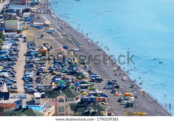 Camping on the seashore in the\
village of Rybachye, in eastern Crimea, Alushta district July\
2019