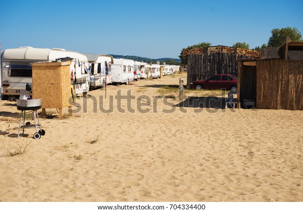 Camping place on the beach with caravans.\
Campers on the sand, Black sea,\
Bulgaria