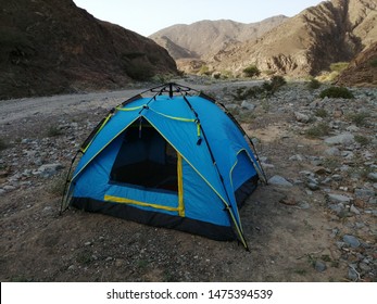 Camping In The Rugged Terrain Of Wadi Showka, A Dried Riverbed, In Ras Al Khaimah Emirate In The United Arab Emirates (UAE).