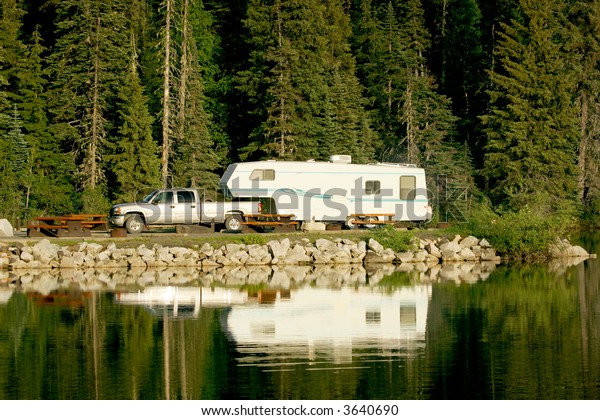 Camping with RV trailer on Meziadin Lake, British\
Columbia, Canada