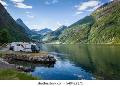 Camping Site At Geiranger Fjord Shore. Evening Light And Calm Summer Day In Norway.