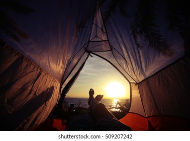A Camping Tent Glows Under Sunset To A Night Sky Outdoor Camping Adventure