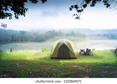 Camping Tent With Lake Background.