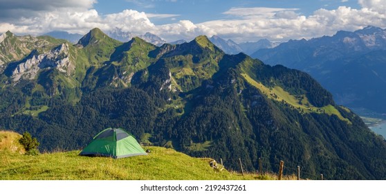 Camping tent in the Mountains around Brunnen town from Fronalpstock, Switzerland, Europe banner