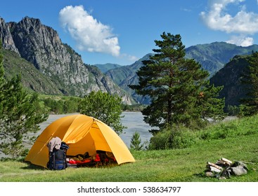 The Camping Tent near mountain river in the summer