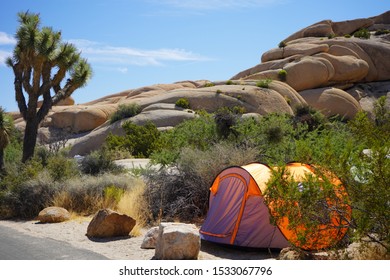 Camping Tent Near Stones Formation In Joshua Tree National Park, California, USA