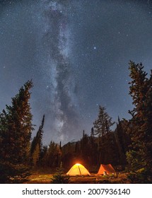 Camping Tents With Milky Way And Starry In The Night Sky On Campsite In Autumn Forest At National Park