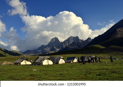 Camping tents near the lakes at the Kashmir Great Lakes trek, which starts from Sonamarg to Naranag Village in Jammu & Kashmir, India. This is an alpine himalayan high-altitude trek in Kashmir Valley.