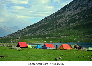 Camping tents at the Nundkol lake which is near the Gangabal lake, at the base of Mount Harmukh. This is the last lake on the Kashmir Great Lake trek which is an alpine high altitude trek in Kashmir. 