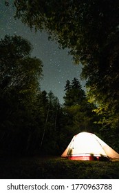 Camping under a starry sky in the forests of Northern Minnesota. - Shutterstock ID 1770963788