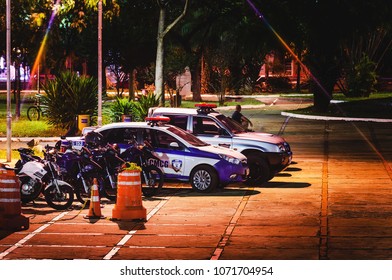 Campo Grande, Brazil - April 14, 2018: Local Police Cars (Guarda Municipal) At Night On An Event (Festival Cine Novo Oeste) In Campo Grande City, Open Air Event At The Praca Do Radio Clube.