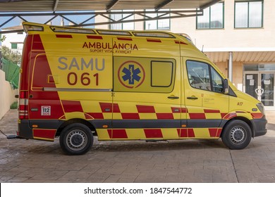 Campos, Balearic Islands/Spain; November 2020: Ambulance Parked At The Public Health Center In The Town Of Campos. Vehicle Painted Yellow And Red