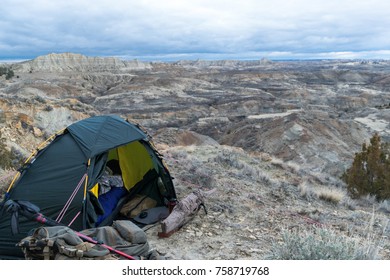 Campsite With A Tent And Hunting Gear In The Badlands Area Of The Border Of Eastern Montana And Western North Dakota On An Early Winter Day. Overcast Sky. Concept For Public / BLM Land Use