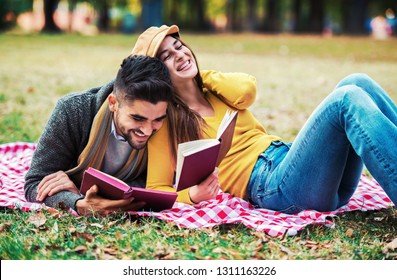 Campus Life, Student's Love. Beautiful Couple Learning Together In The Autumn Park. Education, Love And Tenderness, Dating, Romance, Lifestyle Concept