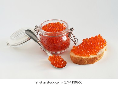 A can of chum salmon caviar, a sandwich and a spoon                              - Shutterstock ID 1744139660