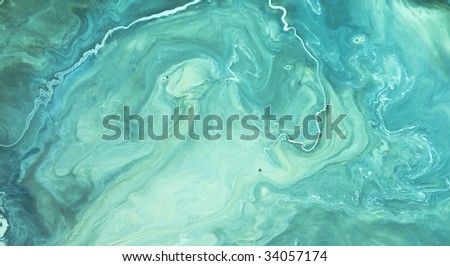 Can of cream paint that has separated and looks like swirls of green