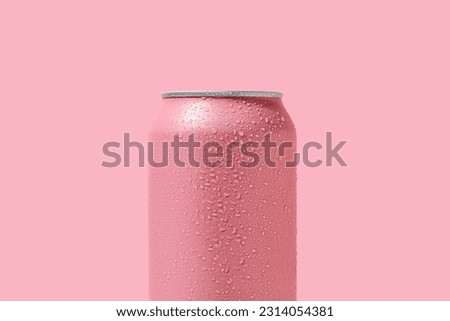 Can of fresh soda with water drops on pink background, closeup