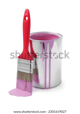 Can with pink paint and brush on white background