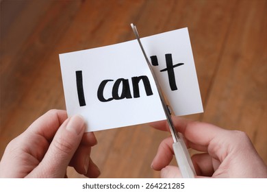 I can self motivation - cutting the letter t of the written word I can't so it says I can - Shutterstock ID 264221285
