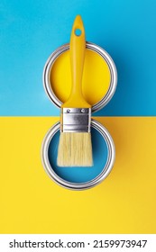 Can of yellow paint with brush on yellow and blue background. Top view, redecorating in ukrainian flag colors. - Shutterstock ID 2159973947