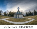 Cana Island Lighthouse on Lake Michigan in Door County, Wi.  I used my fisheye lens to get the wide, slightly distorted look.