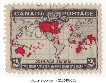 CANADA - 1898  December 7: An Old Canadian Postage Stamp. Canceled 2-cent Lavender, Carmine And Black Postage Stamp Depicting A Map Of The British Empire In Mercator Projection. XMAS 1898