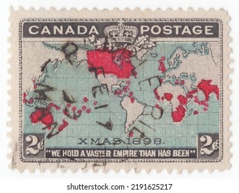 CANADA - 1898 December 7: An Old 2-cent Black On Blue And Carmine Postage Stamp Depicting A Map Of The British Empire In Mercator Projection. XMAS 1898