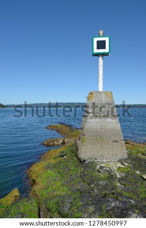 Canada, British Columbia, Island. Navigational marker on the reef at the entrance to Prates Cove
