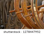 Canada, British Columbia, Victoria. Brass and wood steering wheel on the USCG Eagle is a three-masted sailing back home ported at the Coast Guard Academy in New London, Connecticut