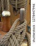 Canada, British Columbia, Victoria. Rigging rope wrapped around a wooden peg on the USCG Eagle is a three-masted sailing back ported at the Coast Guard Academy in New London, Connecticut