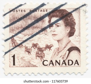 CANADA - CIRCA 1967: A Stamp Printed In Canada, Shows Portrait Of Queen Elizabeth II,  Northern Lights And Dog Team, Circa 1967